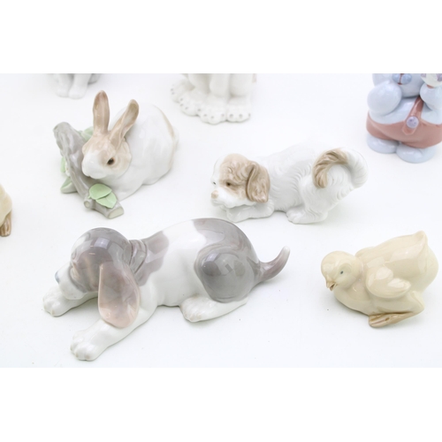 246 - A collection of Lladro animals to include a rabbit on branch, a beagle / hound, with Nao figures suc... 