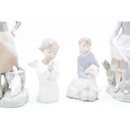 248 - Lladro figures to include a girl with goose, an angel, a boy with sheep and a girl with hare (4).