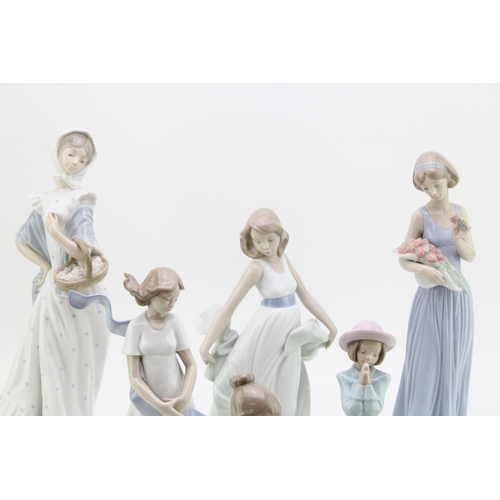 250 - Nao figures to include a boy with wheel barrow, a girl with a basket ad others (6), 33cm tall.