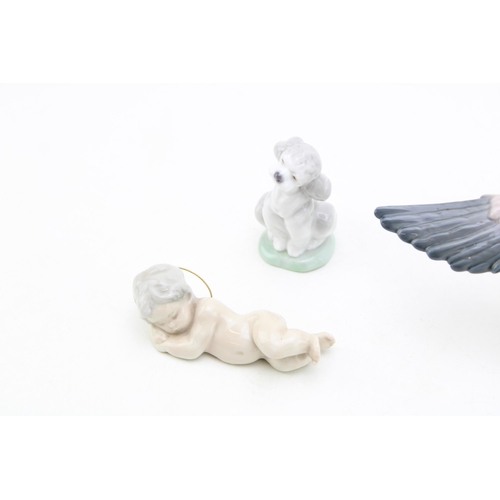 253 - Lladro animals to include a Landing Crane 1600, a Lladro dog and a Cherub (3).