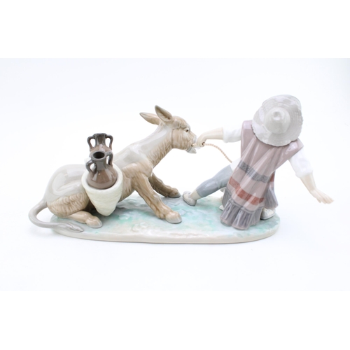 256 - Lladro Man Pulling Donkey, 27cm wide.