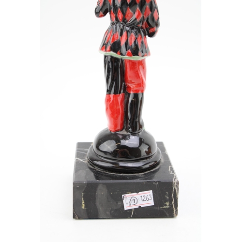 268 - A ceramic Harlequin figure playing the mandolin on marble base,  possibly Doulton or similar. Height... 