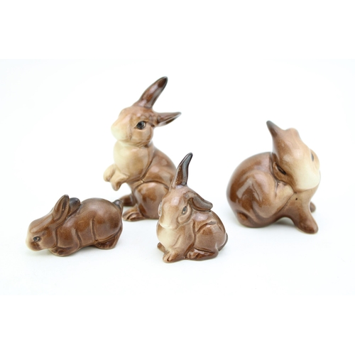 27 - A collection of four Beswick rabbits (4).