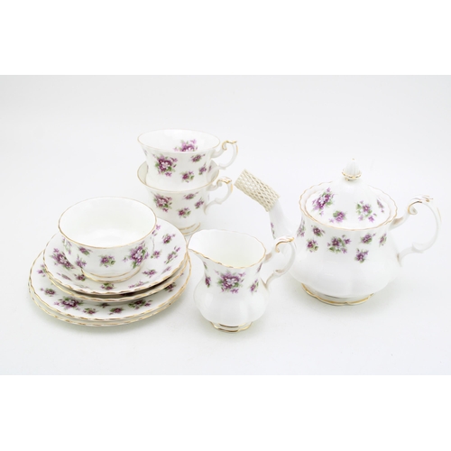 306 - Royal Albert tea for two set in the Sweet Violets pattern to include a small teapot, two cups, two s... 