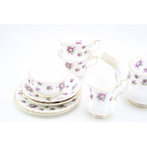 306 - Royal Albert tea for two set in the Sweet Violets pattern to include a small teapot, two cups, two s... 