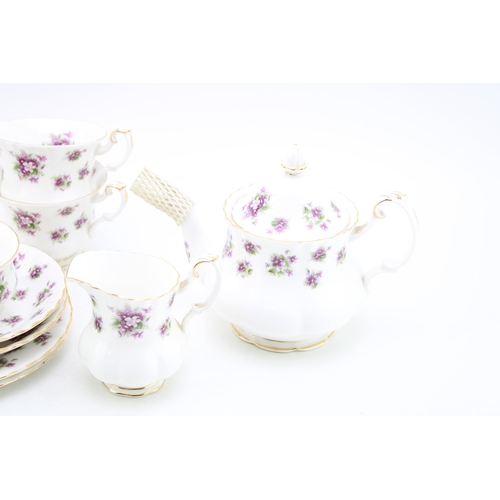 306 - Royal Albert tea for two set in the Sweet Violets pattern to include a small teapot, two cups, two s... 