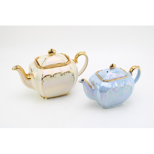 310 - Sadler teapot in cream together with a small blue Sadler example (2).