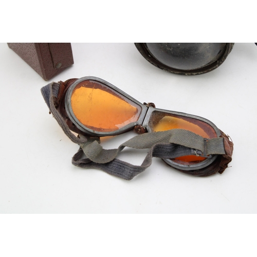 325 - A C.A.V motorcycle headlamp with bullseye lens together with a pair of goggles in leatherette box. (... 