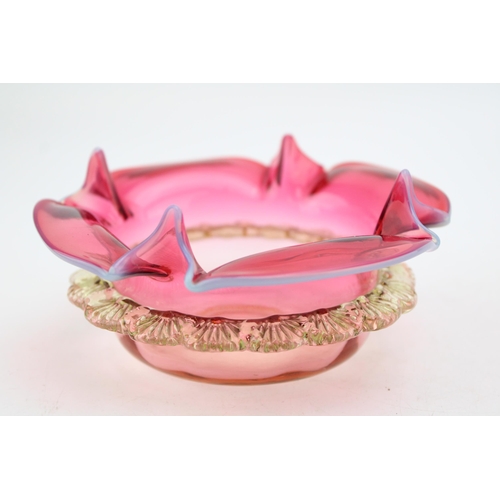 326 - Victorian cranberry glass bowl, shaped edges, with uranium glass base and rim, 13cm diameter.