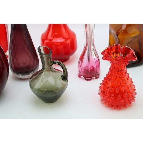 353 - A collection of vintage glassware to include mid century examples predominantly in reds and purples.... 