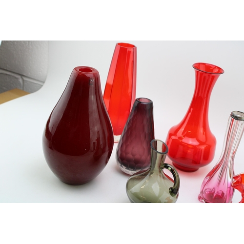 353 - A collection of vintage glassware to include mid century examples predominantly in reds and purples.... 