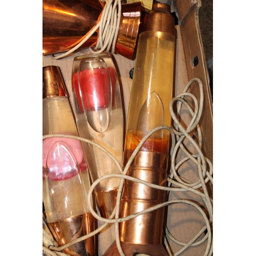 360 - A collection of vintage lava lamps dating from the 1960s and 1970s. With copper bases. Height 44cm. ... 