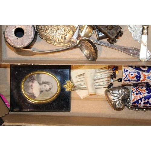 369 - An interesting collection of items to include hatpins, silver plated items, miniature coach tape  me... 