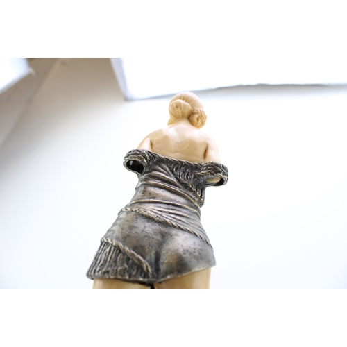 370 - A nude figure in resin and metal on marble base. Height 34cm.