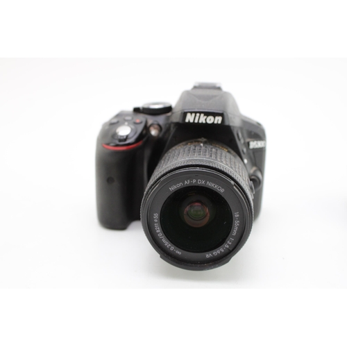 376 - Nikon D5300 DSLR camera with 18-55mm lens, turns on but non-working, with battery charger.