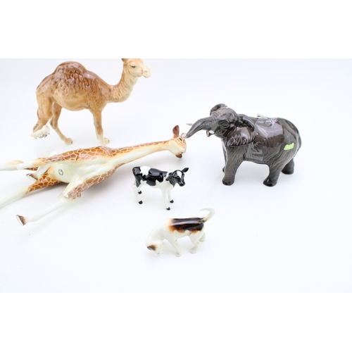 4 - A collection of damaged Beswick figures to include large giraffe, elephant, camel and two others (5 ... 