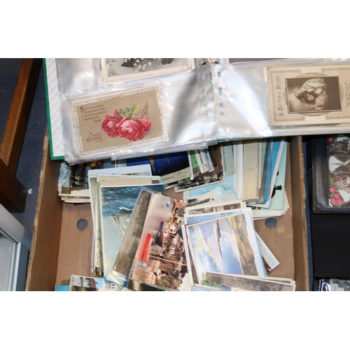 418 - A large and varied collection of antique and vintage postcards to include four folders together with... 