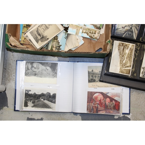 418 - A large and varied collection of antique and vintage postcards to include four folders together with... 