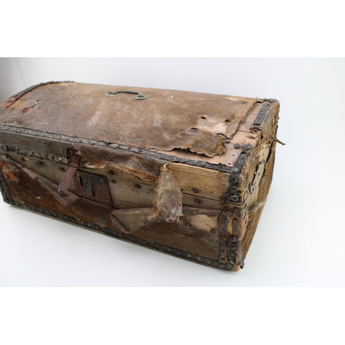 432 - An early c19th hide covered wooden travel trunk for restoration