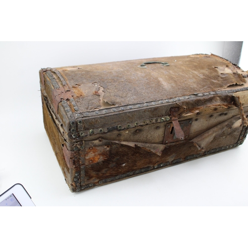 432 - An early c19th hide covered wooden travel trunk for restoration