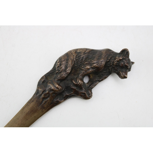 447 - Cast metal page turner / letter opener with grizzly bear finial, 24cm tall.