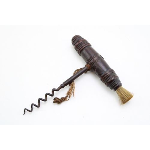 448 - An antique Henshall type corkscrew with turned handle and dust brush. Length 13cm.