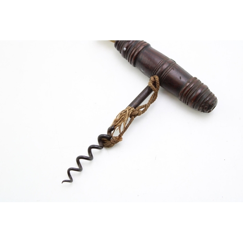 448 - An antique Henshall type corkscrew with turned handle and dust brush. Length 13cm.