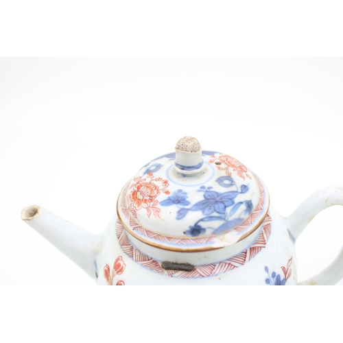 457 - Two Chinese porcelain teapots, one ribbed, repaired metal spout (2), 21cm wide.