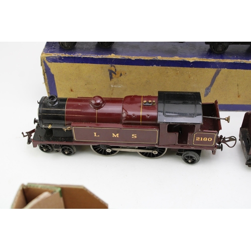 483 - A Hornby O gauge clockwork 4-4-2 2180 LMS locomotive together with tender and carriage. (3)