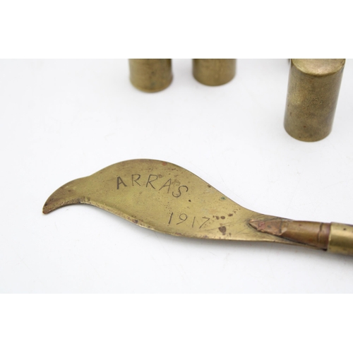 512 - World War One trench art to include a cutlass and two lighters, 'Arras 1917' (3).