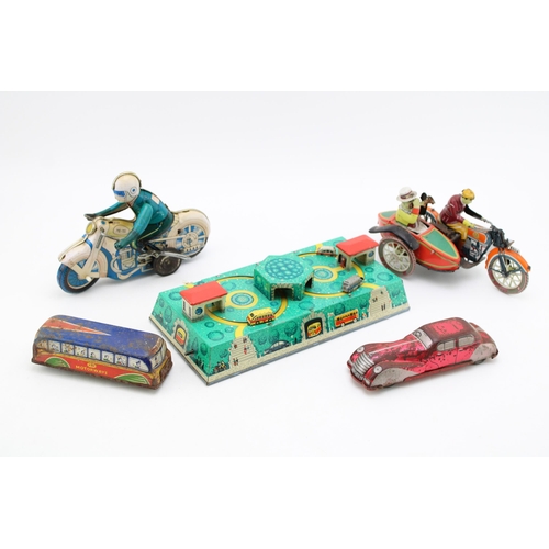 514 - A collection of clockwork tinplate toys, Made in DDR and Eastern Europe to include, 'Motorcycle' (wo... 