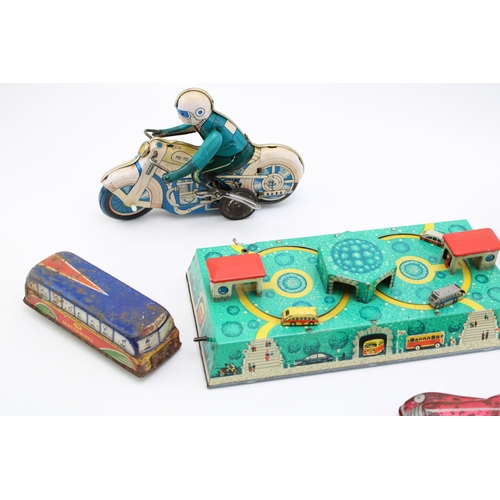 514 - A collection of clockwork tinplate toys, Made in DDR and Eastern Europe to include, 'Motorcycle' (wo... 