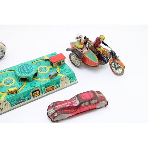 514 - A collection of clockwork tinplate toys, Made in DDR and Eastern Europe to include, 'Motorcycle' (wo... 