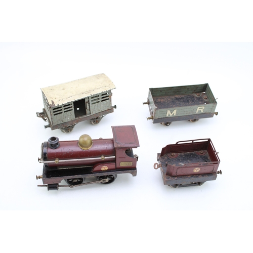 518 - A Hornby clockwork train set circa 1920s, to include engine and tender, cattle truck and M R wagon. ... 