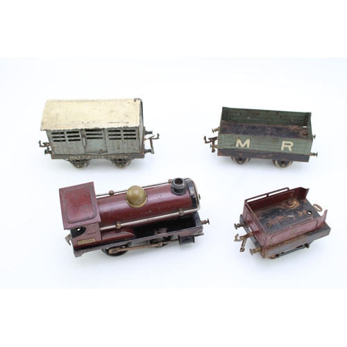 518 - A Hornby clockwork train set circa 1920s, to include engine and tender, cattle truck and M R wagon. ... 