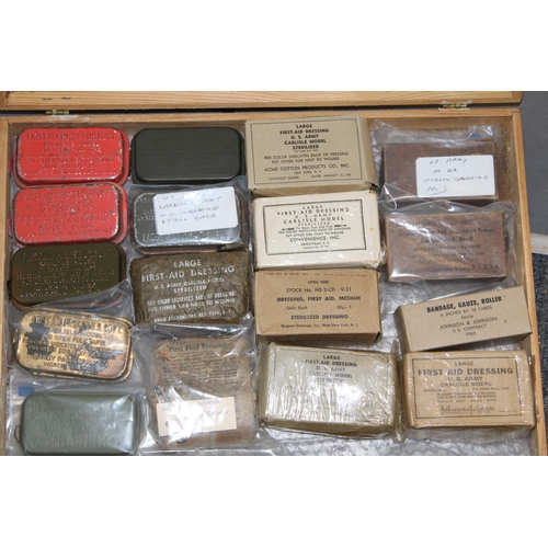 529 - A collection of British and American army first aid kits to include 1942 US Army First Aid Pouch, a ... 