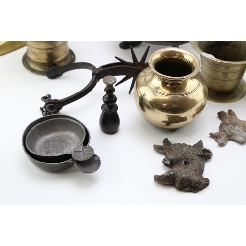 543 - A collection of c18th & c19th brass candlesticks and other brass items including mortars, a stand an... 