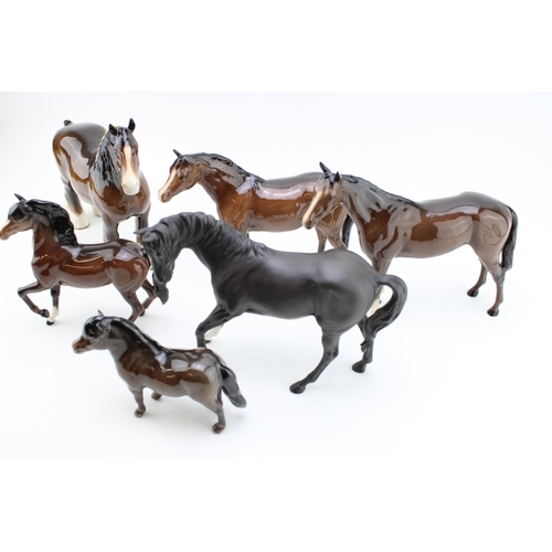 57 - A collection of Beswick horses to include an 818 shire, Black Beauty, a brown prancing arab and othe... 