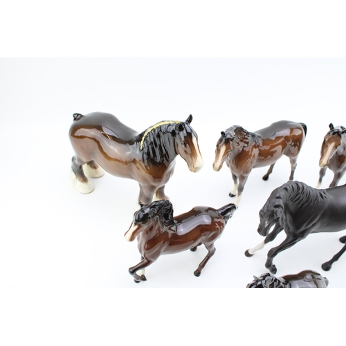 57 - A collection of Beswick horses to include an 818 shire, Black Beauty, a brown prancing arab and othe... 