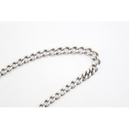 590 - A silver Albert chain, graduated links, each link hallmarked, Length 33.5cm. Weight 21.8g