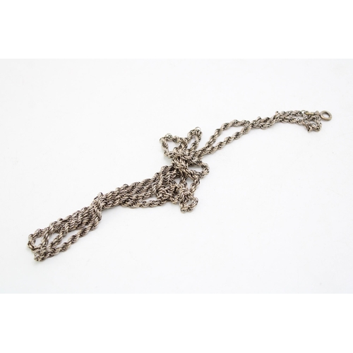 599 - White metal (tests as silver) fancy link longuard chain, 62.6g, with metal clasp, 130cm long, with a... 