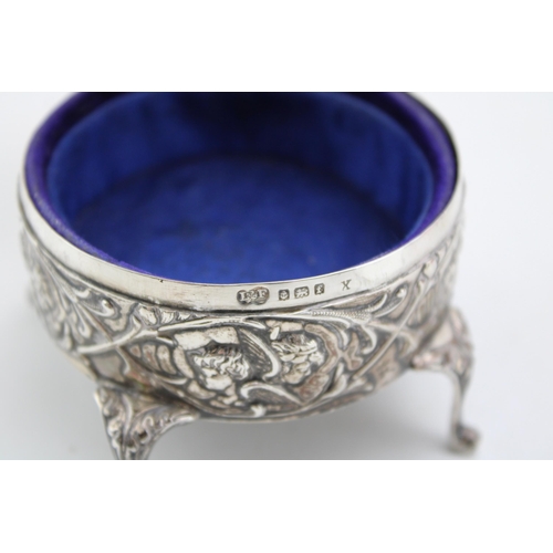 602 - Silver four legged trinket box, Reynold's Angels design, Birmingham 1905, 8cm diameter.