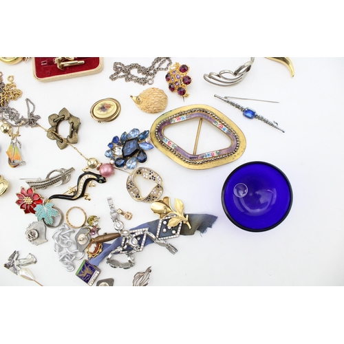 630 - A group of vintage and later costume jewellery, including a silver and enamel boat brooch, a pair of... 