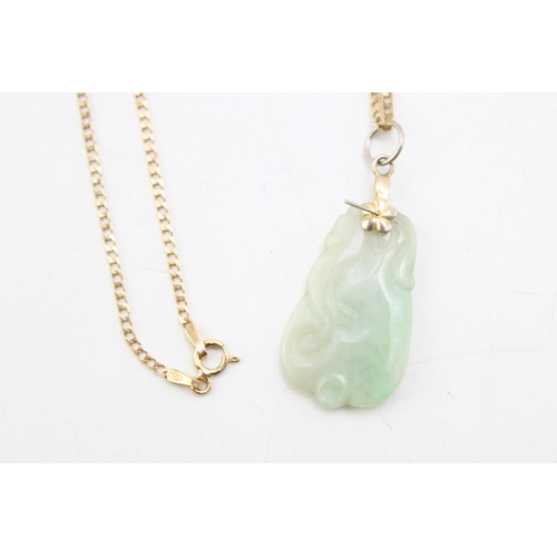 643 - A 9ct yellow gold chain (weight 2.2g) with jadeite carved pendant. Gross weight 5.7g.