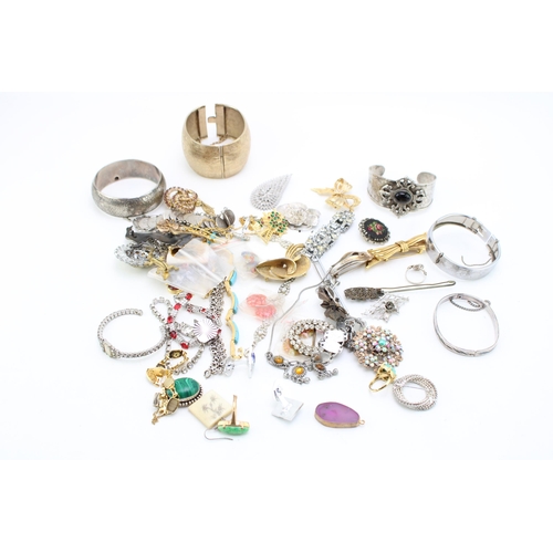 644 - A group of vintage and later costume jewellery including two white metal bangles, likely Indian poss... 