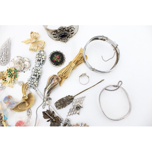 644 - A group of vintage and later costume jewellery including two white metal bangles, likely Indian poss... 