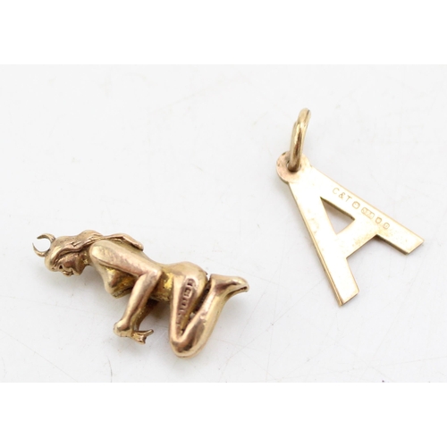 667 - Two 9ct gold charms, comprising one of a kneeling female, the other the letter 'A', 3.4g total weigh... 