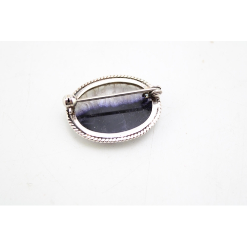 669 - A Blue John brooch with silver mount. Height 3cm.