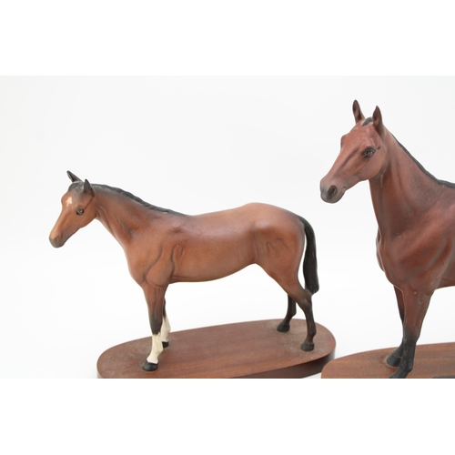 76 - Beswick model 'Arkle' Champion Steeplechaser together with another example by Royal Doulton. Height ... 