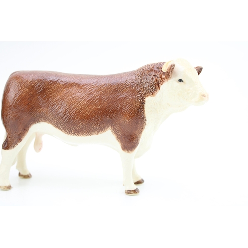 86 - Border Fine Arts pottery figure of a Hereford Bull and a Hereford Cow (2).